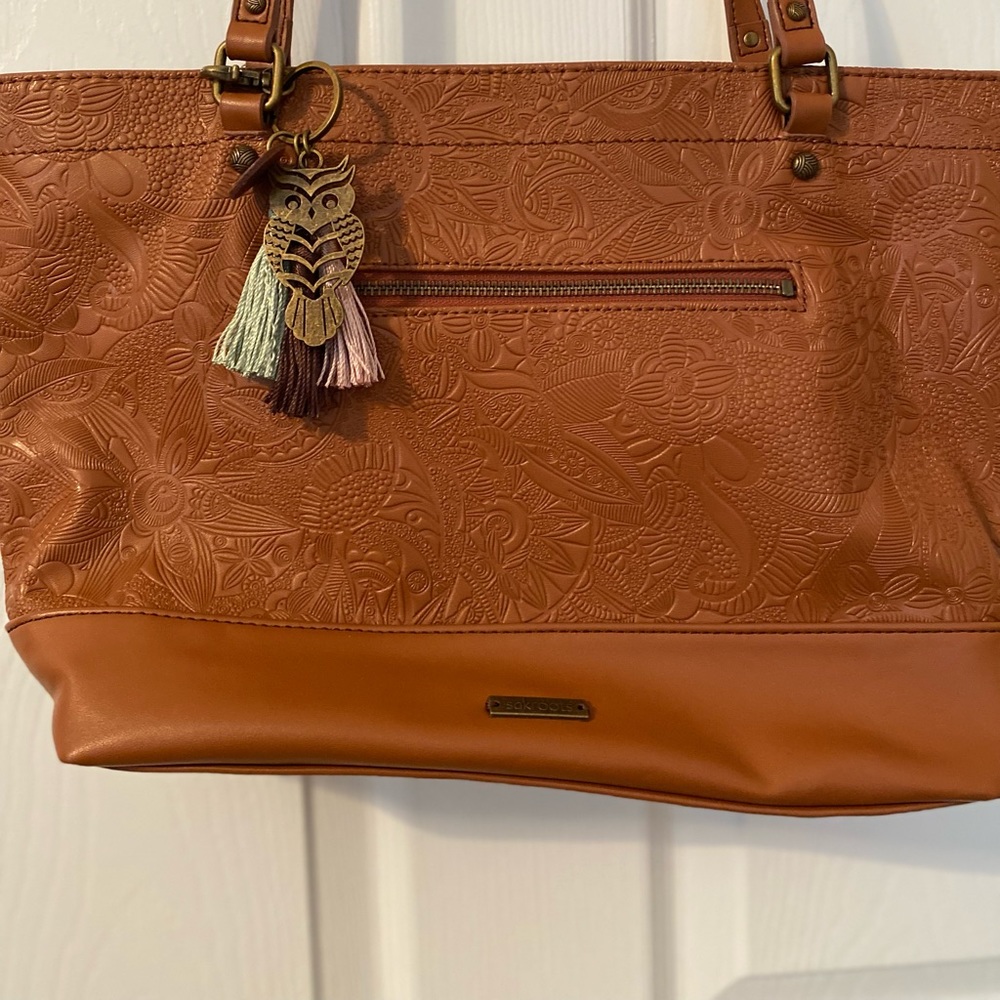 A slightly used but in excellent condition Sakroots handbag